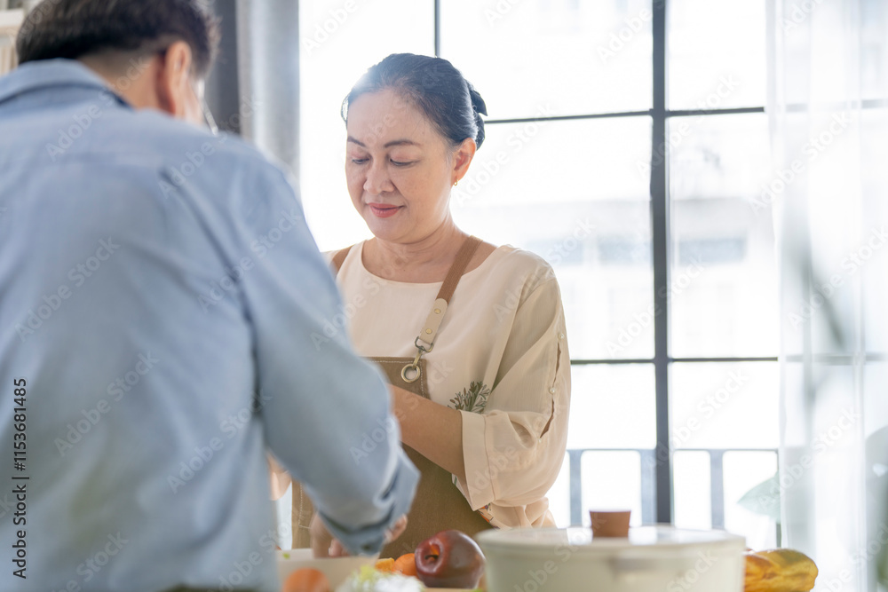 A woman prepares fresh vegetables in a cozy kitchen, while a man assists in the background. The scene emphasizes a warm and healthy lifestyle with a focus on fresh produce and home cooking. A woman prepares fresh vegetables in a cozy kitchen, while a man assists in the background. The scene emphasizes a warm and healthy lifestyle with a focus on fresh produce and home cooking.