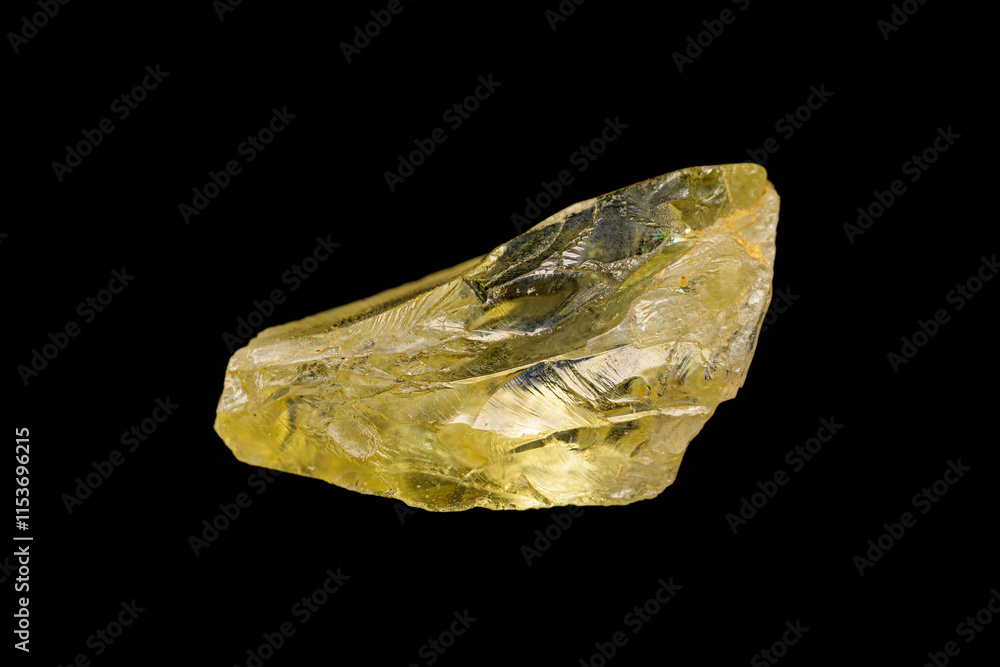 Natural rough transparent orthoclase (jewelry grade) on dark background (feldspar group)(selective focus) Natural rough transparent orthoclase (jewelry grade) on dark background (feldspar group)(selective focus)