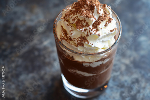 A decadent keto chocolate mousse in a glass, topped with whipped cream and cocoa powder, indulgent and sugar free photo