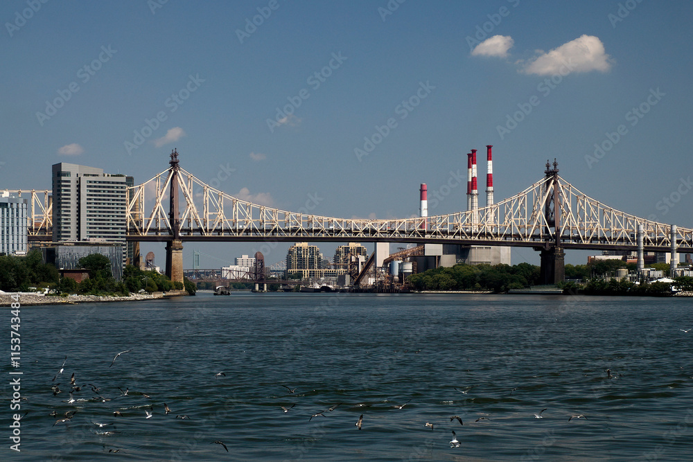 Queensboro Bridge in New York City, spanning the East River. new york manhattan view from east river Queensboro Bridge in New York City, spanning the East River. new york manhattan view from east river