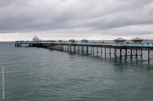 Llandudno is a picturesque seaside town in Wales, known for its elegant Victorian architecture, wide promenade, sandy beaches, and the Great Orme hill offering stunning views. photo