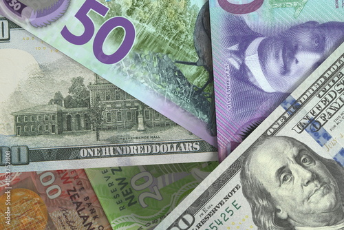 Banknotes New Zealand dollar and US dollar . Cash. Financial concept.