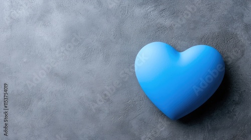 A blue heart shape on a textured gray background, symbolizing love, calmness, and affection.