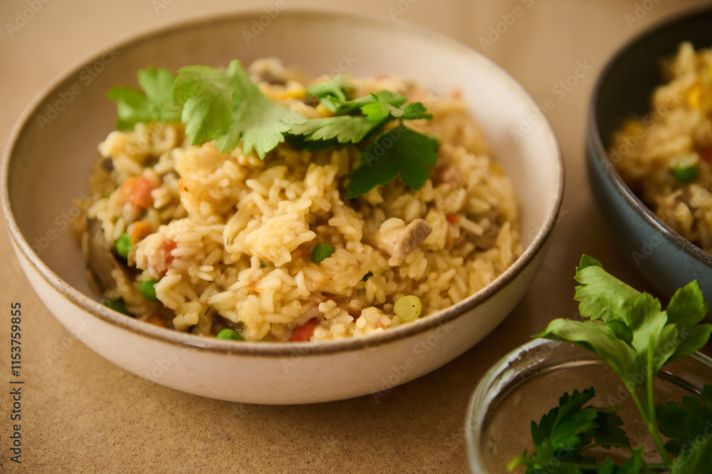 Delicious vegetable paella garnished with fresh parsley in ceramic bowl Delicious vegetable paella garnished with fresh parsley in ceramic bowl
