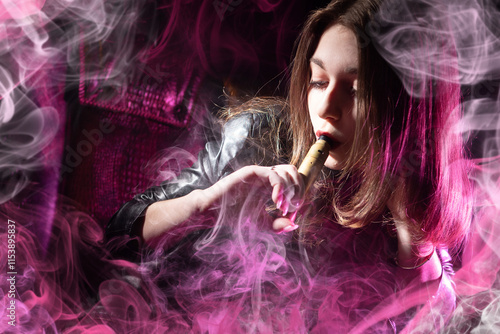 Woman smokes vape. Vaper gi...