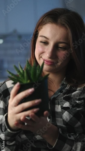 Attractive Young Girl Checks Home Plant In A Pot While At Home, Vertical Video