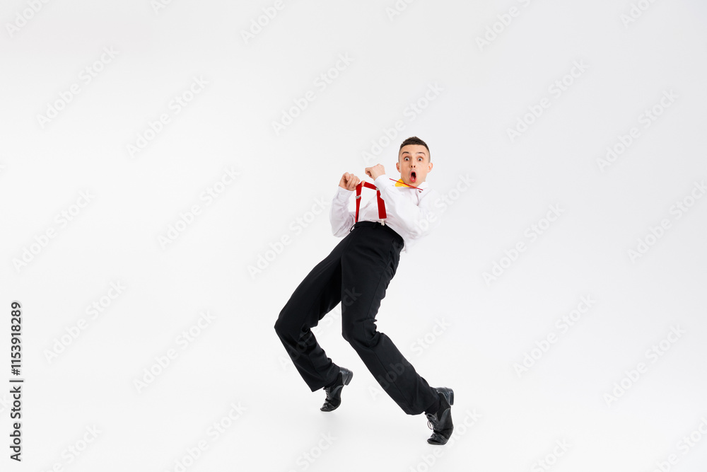 Full size photo of classy young man have fun pull suspenders dance vintage outfit isolated on white color background Full size photo of classy young man have fun pull suspenders dance vintage outfit isolated on white color background