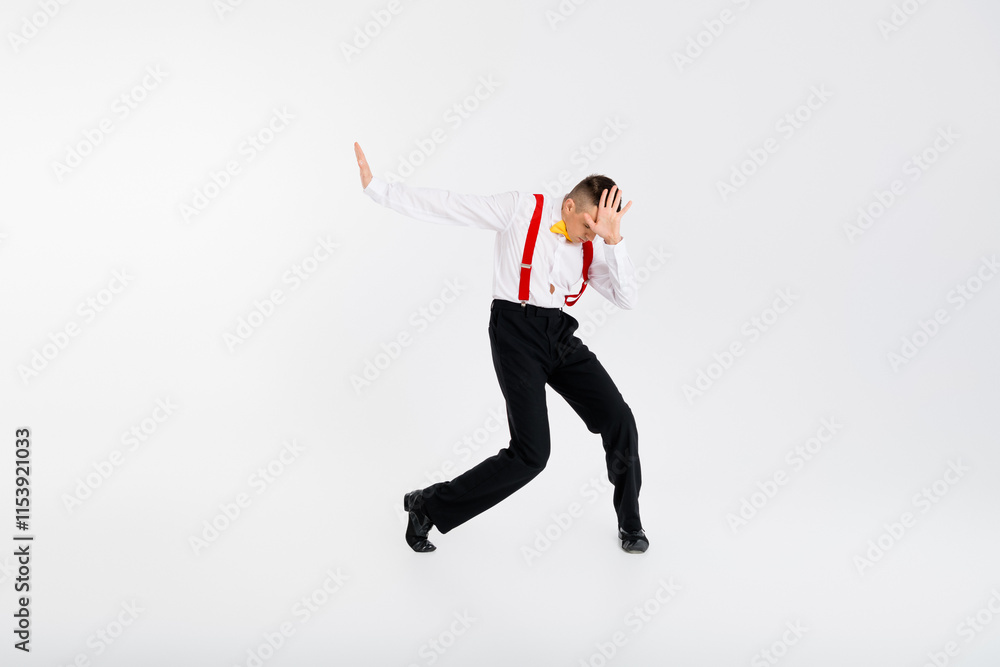Full body portrait of funny elegant young man dancing isolated on white color background Full body portrait of funny elegant young man dancing isolated on white color background