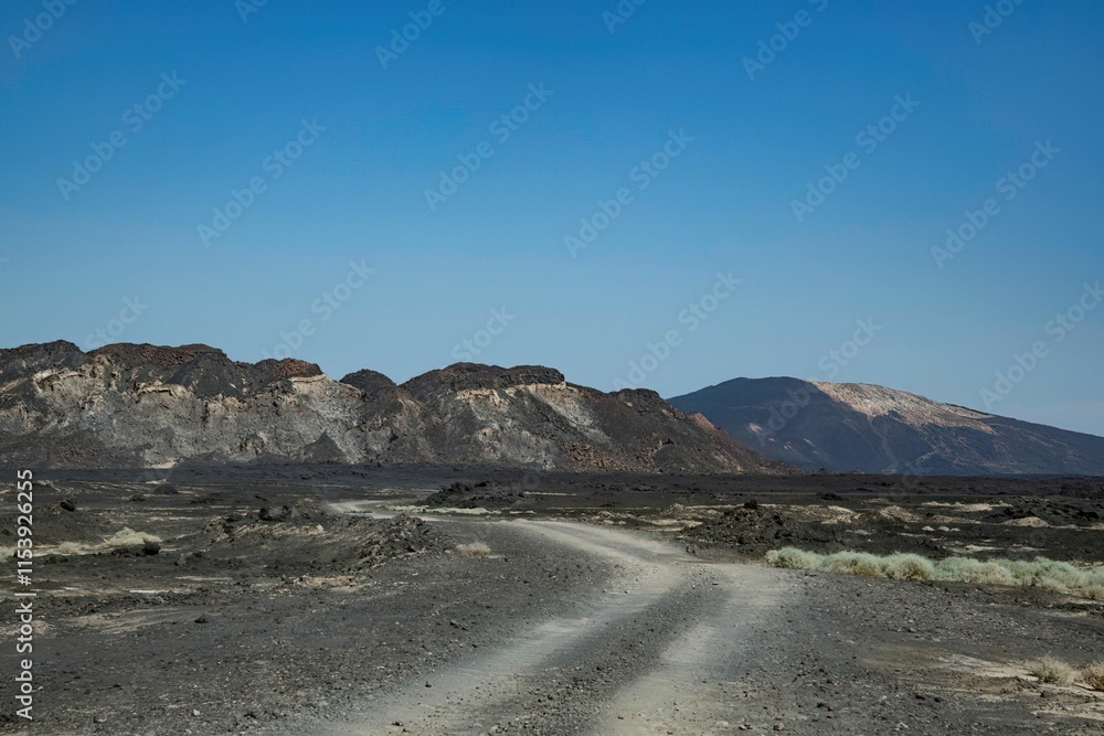 Road through the remote volcanic landscape of the Afar region in Ethiopia Road through the remote volcanic landscape of the Afar region in Ethiopia