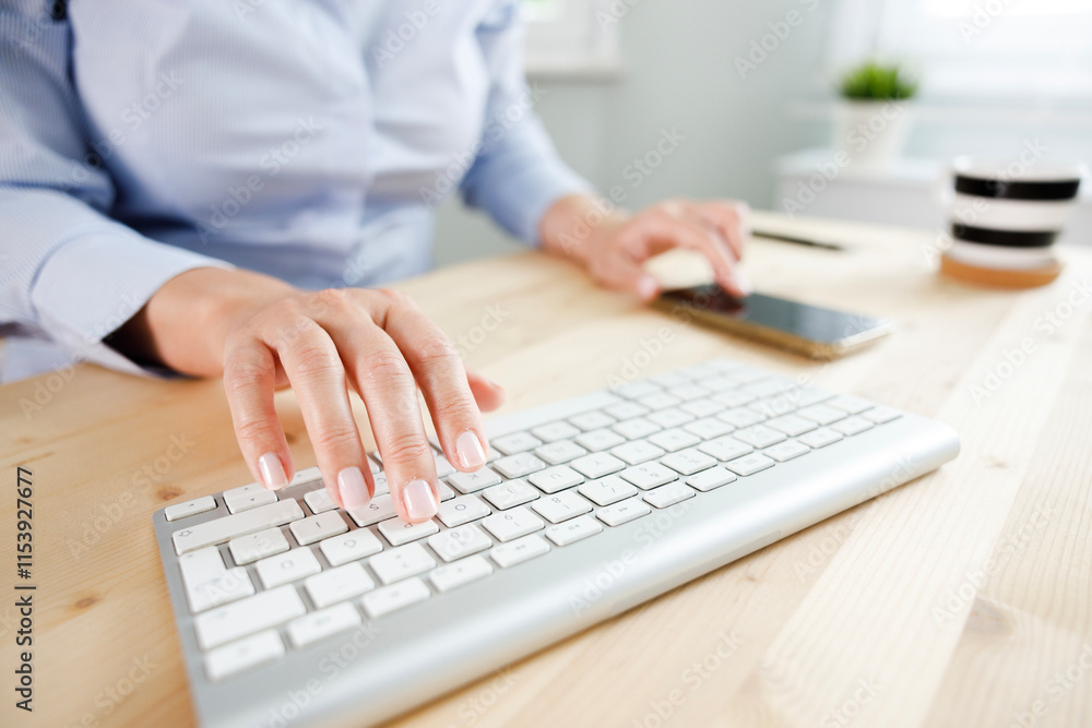 Close-up of business woman's hands touching computer keys during work Close-up of business woman's hands touching computer keys during work