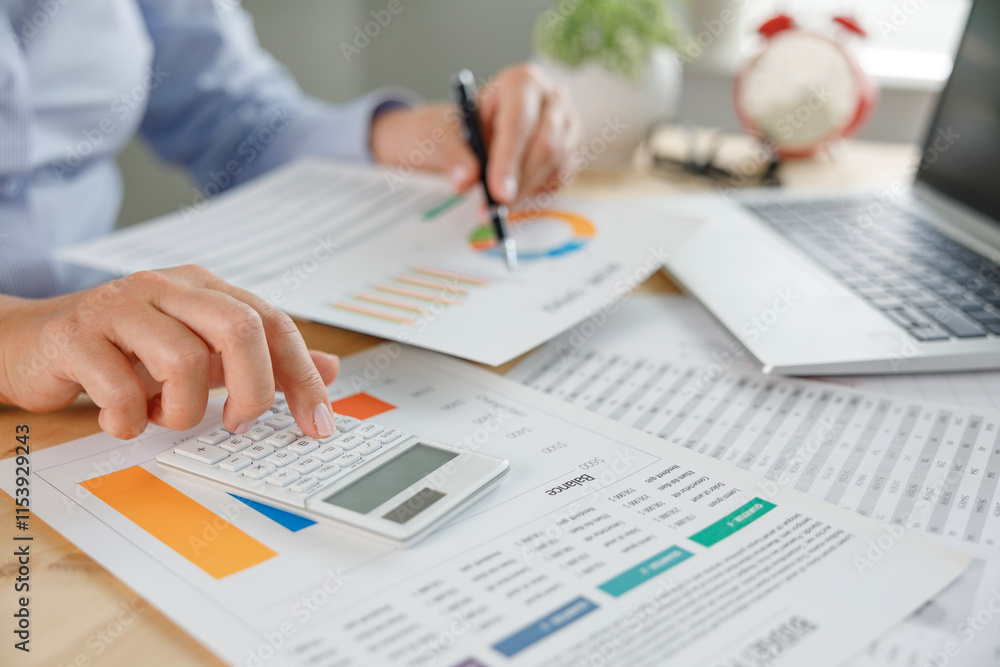 Businesswoman financial planning and making accounting database report at workplace Businesswoman financial planning and making accounting database report at workplace