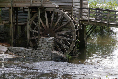 Fotografie Old grist mill water wheel