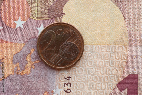 European currency euro cent coin lies on euro banknote bill photo