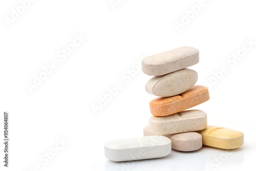 Colorful Assorted Tablets Placed on Right Side on White Background with Copy Space - Vibrant Medicine Stack photo