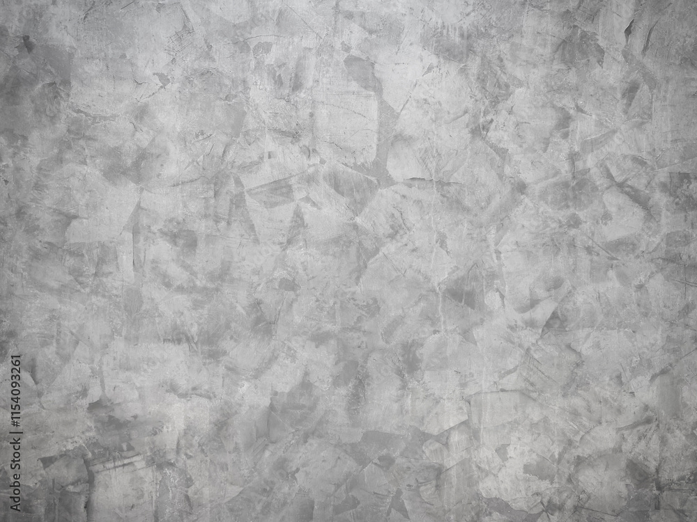 Naklejka premium Textured concrete wall with subtle patterns and gray tones.