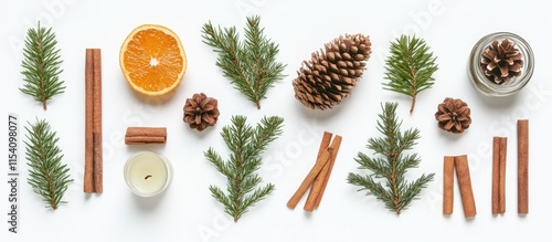 Elegant arrangement of festive seasonal elements including pine, orange, and cinnamon on a light background for holiday themes photo