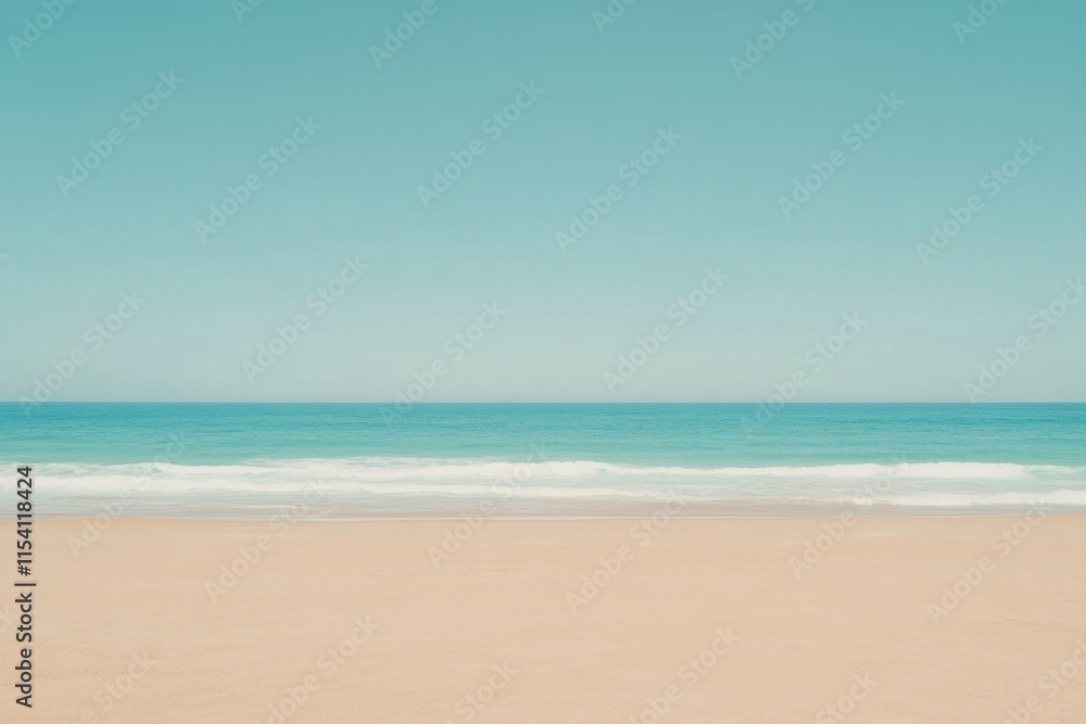Fototapeta premium Calm Beach Scene with Gentle Waves and Clear Blue Sky Above Horizon