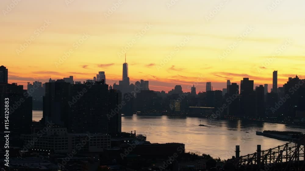 Sunset over the East River, with Lower East Side skyline background and Queensboro Bridge connecting Manhattan and Queens Sunset over the East River, with Lower East Side skyline background and Queensboro Bridge connecting Manhattan and Queens