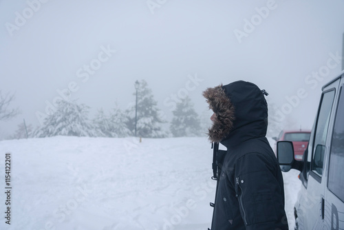 Chica disfrutando de la nieve  photo