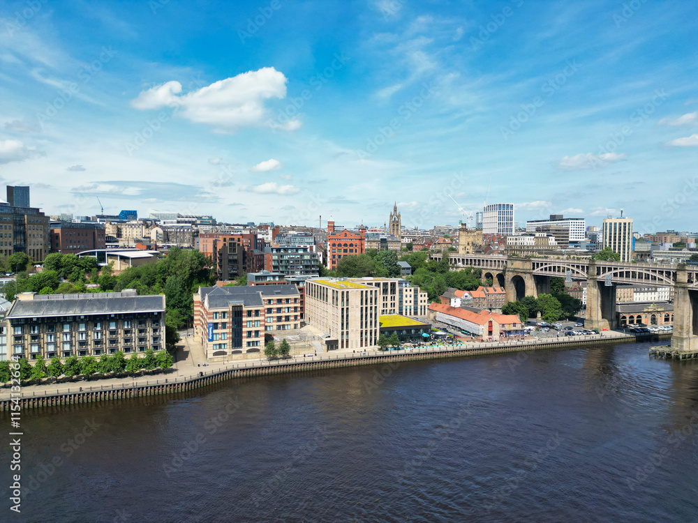 Central Newcastle City from River Tyne at Northern England United Kingdom. July 19th, 2024, High Angle Drone's Camera Footage Was Captured from Medium High Altitude. Central Newcastle City from River Tyne at Northern England United Kingdom. July 19th, 2024, High Angle Drone's Camera Footage Was Captured from Medium High Altitude.