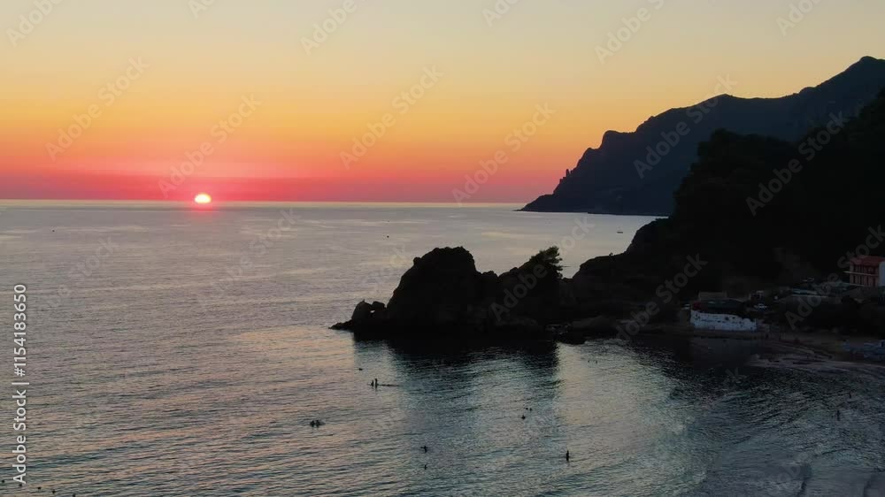 Sunset over coastal mountains and ocean corfu island ,Greece Sunset over coastal mountains and ocean corfu island ,Greece
