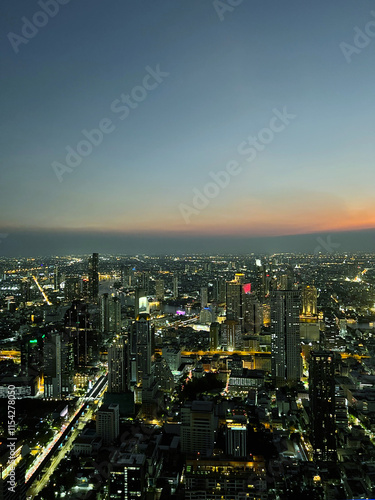 Wallpaper Mural Title:

Nighttime Cityscape of Bangkok, Thailand

Description:

A vibrant nighttime view of Bangkok, Thailand, featuring the illuminated skyline with modern skyscrapers, bustling streets, and reflecti Torontodigital.ca