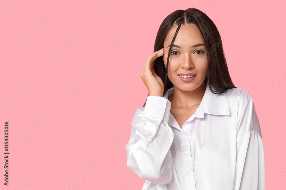 Beautiful young Asian woman with stylish mint makeup on pink background Beautiful young Asian woman with stylish mint makeup on pink background