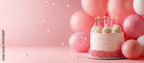 Pastel pink birthday cake with balloons and copy space