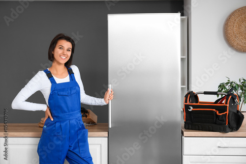 Female worker near fridge i...