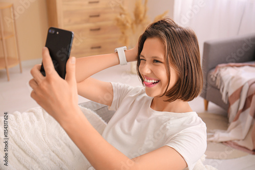 Pretty young woman taking s...