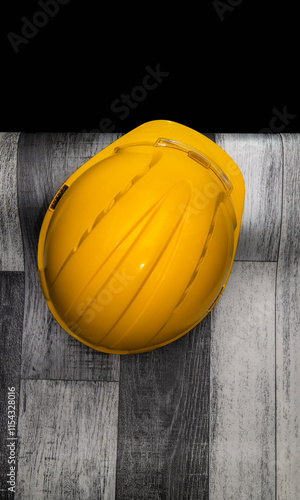 Obraz na płótnie Yellow hard hat resting on construction site floor w salonie