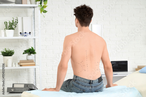 Young man with markings on ...