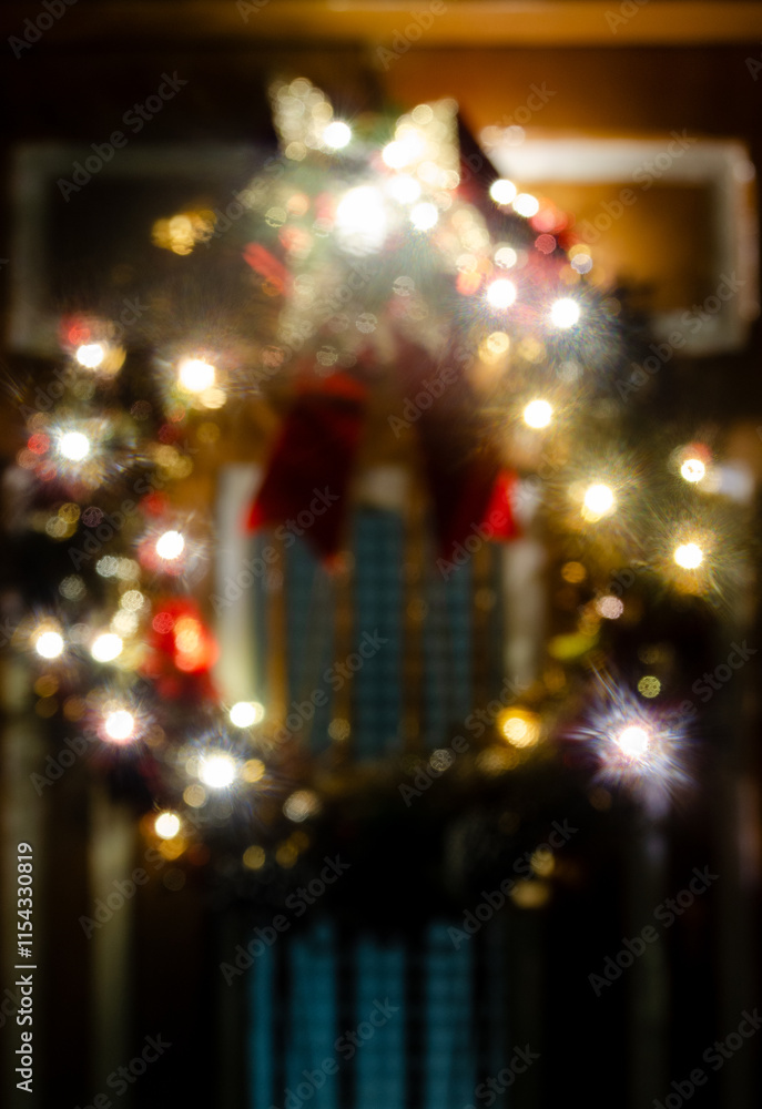 Blurred Christmas wreath, a door with a Christmas wreath with lights defocused, object purposely out of focus. Blurred Christmas wreath, a door with a Christmas wreath with lights defocused, object purposely out of focus.