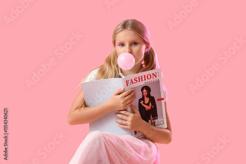 Cute trendy girl with magaz...