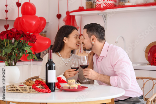 Young couple with wine kiss...