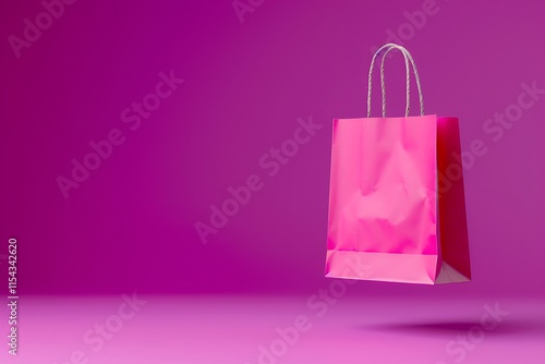 Pink flying paper shopping bag on purple background photo