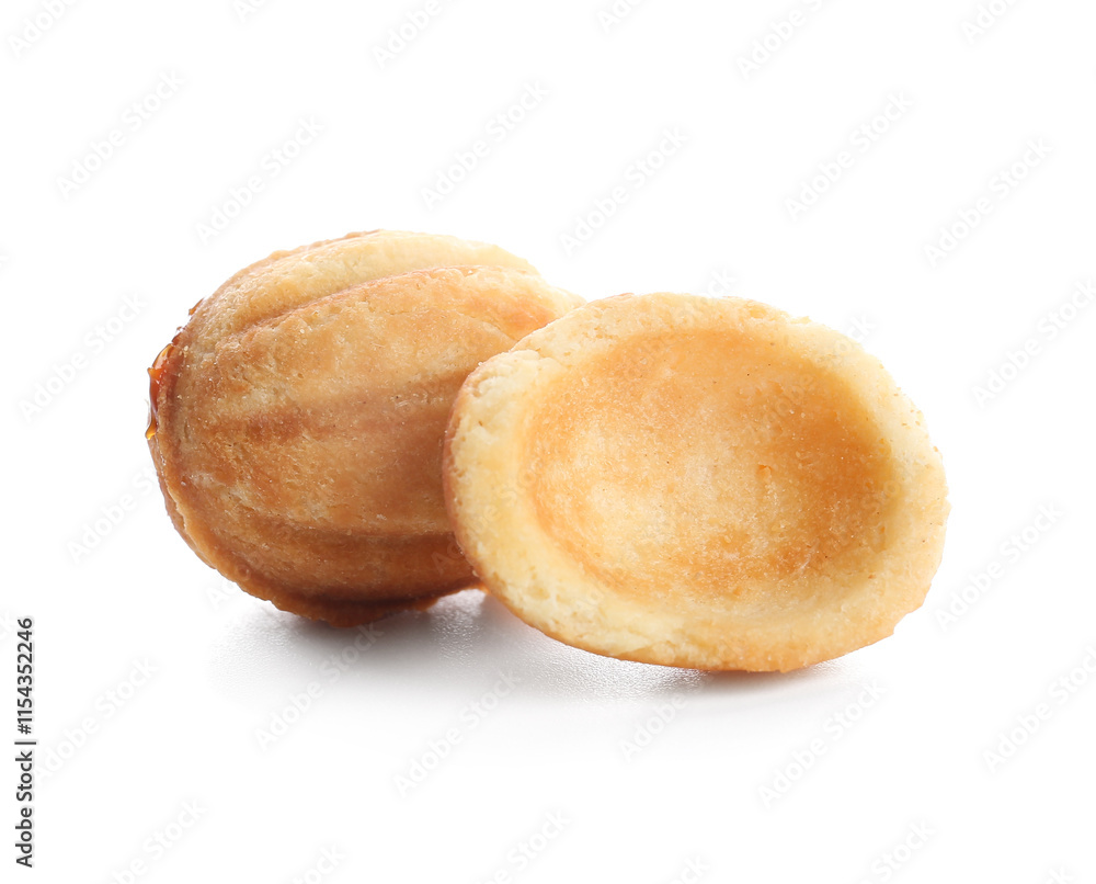 Sweet walnut shaped cookies with boiled condensed milk on white background Sweet walnut shaped cookies with boiled condensed milk on white background