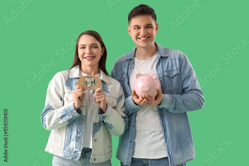 Young couple with piggy ban...