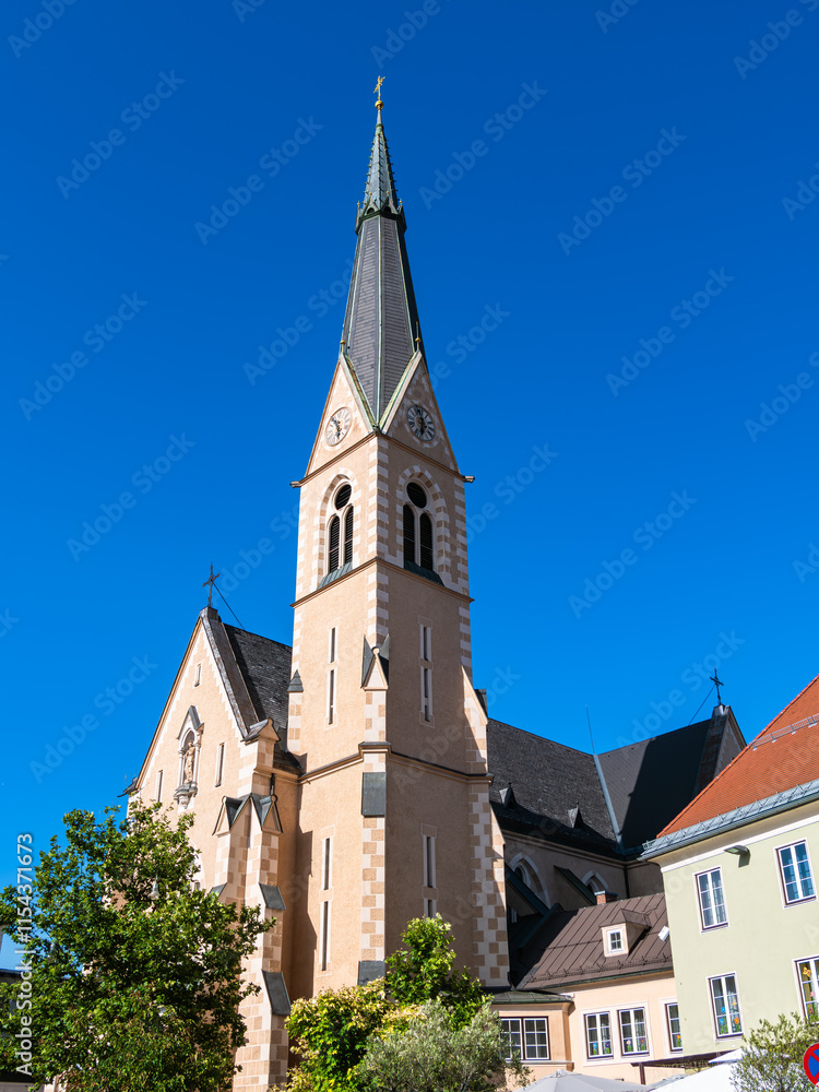 Historic church with steeple against blue sky Historic church with steeple against blue sky