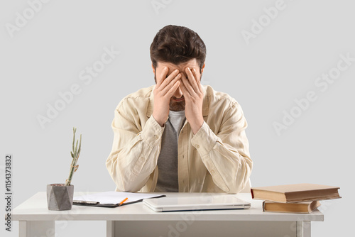 Portrait of worried man at ...