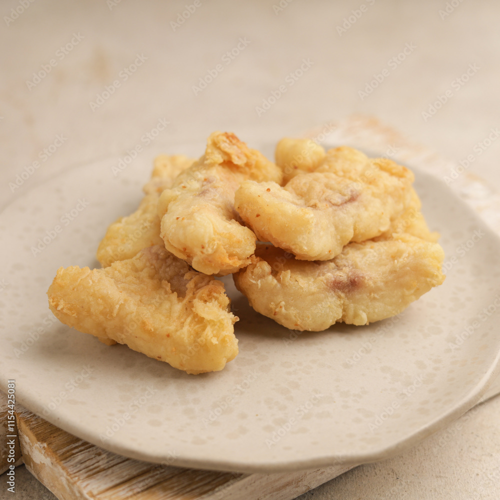 Fried fish nugget on white plate and white background Fried fish nugget on white plate and white background
