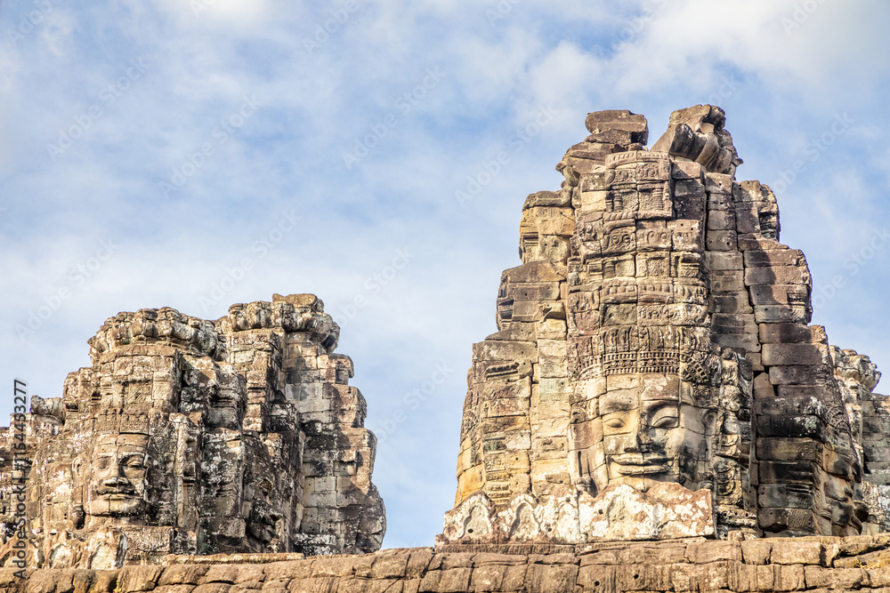 Ancient Bayon temple with carved stone faces, Angkor Thom, Siem Reap, Cambodia