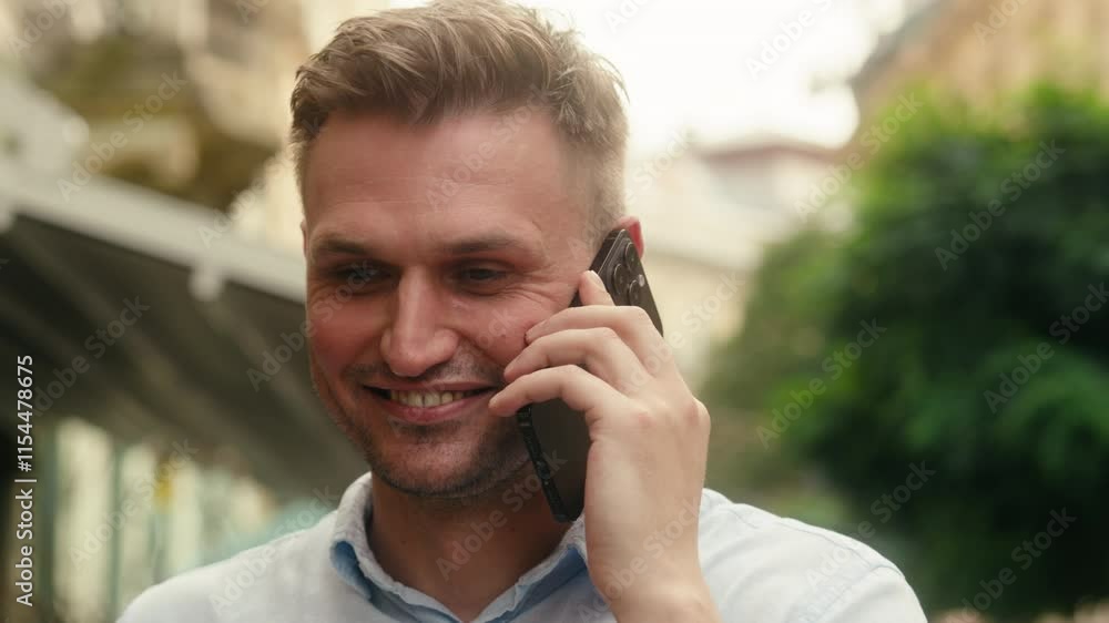 Smiling guy cheerful Caucasian man laughing businessman male tourist traveler in city happy businessman call mobile phone outdoor conversation smartphone chatting with friend summer travel vacations Smiling guy cheerful Caucasian man laughing businessman male tourist traveler in city happy businessman call mobile phone outdoor conversation smartphone chatting with friend summer travel vacations
