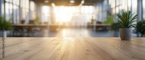 Wallpaper Mural A sunlit office space with a wooden table and a small potted plant. Torontodigital.ca