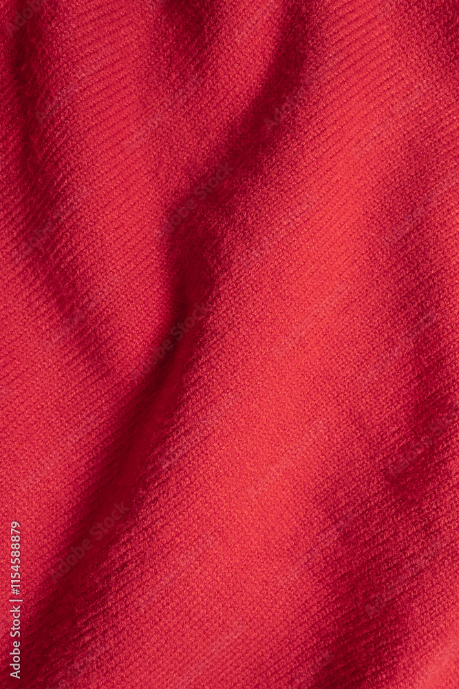 Red cashmere sweater texture. Vertical background. Selective soft focus, copy space Red cashmere sweater texture. Vertical background. Selective soft focus, copy space