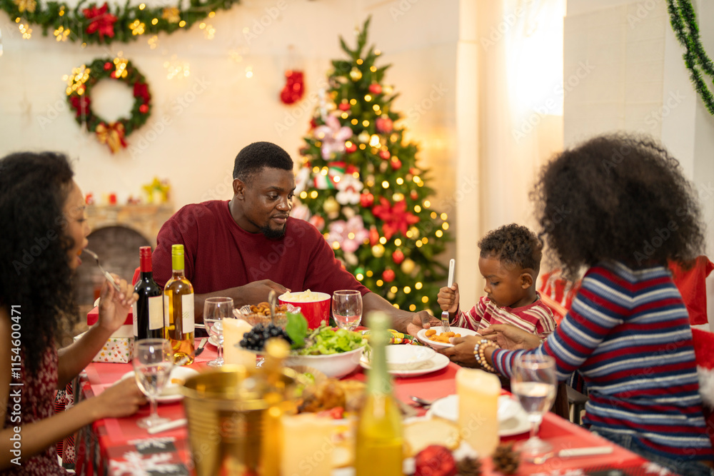A warm Christmas family dinner with a father serving food to his young child, surrounded by festive decorations, a Christmas tree, and a holiday table spread. Joyful and cozy holiday atmosphere. A warm Christmas family dinner with a father serving food to his young child, surrounded by festive decorations, a Christmas tree, and a holiday table spread. Joyful and cozy holiday atmosphere.