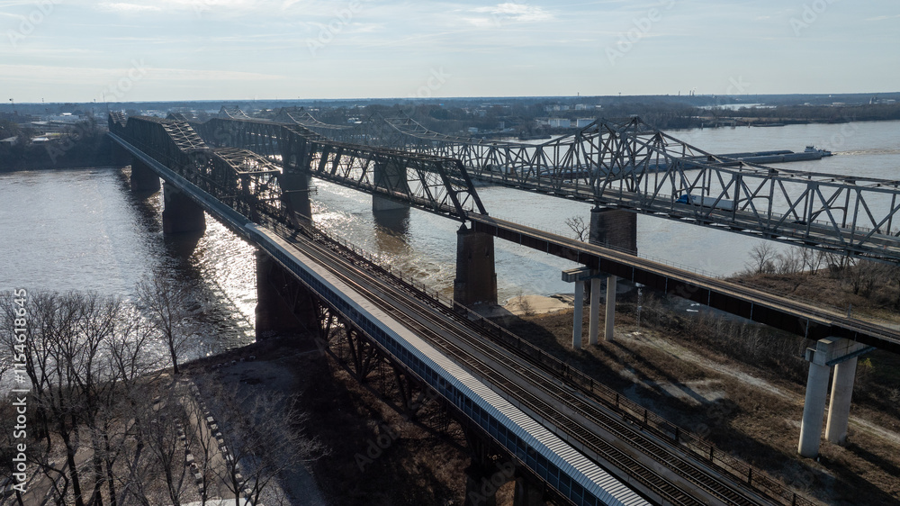 Obraz premium Bridges and Train Tracks Over Water