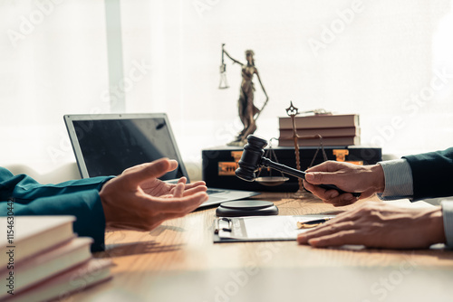 Photos Businesses and lawyers are discussing contract documents and legal entities in law firms and are examining legal documents with the hammer and scales of justice