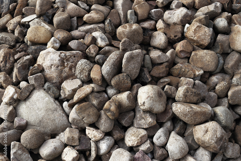 smooth pebbles background. variety of smooth, natural rocks with different shapes and textures smooth pebbles background. variety of smooth, natural rocks with different shapes and textures