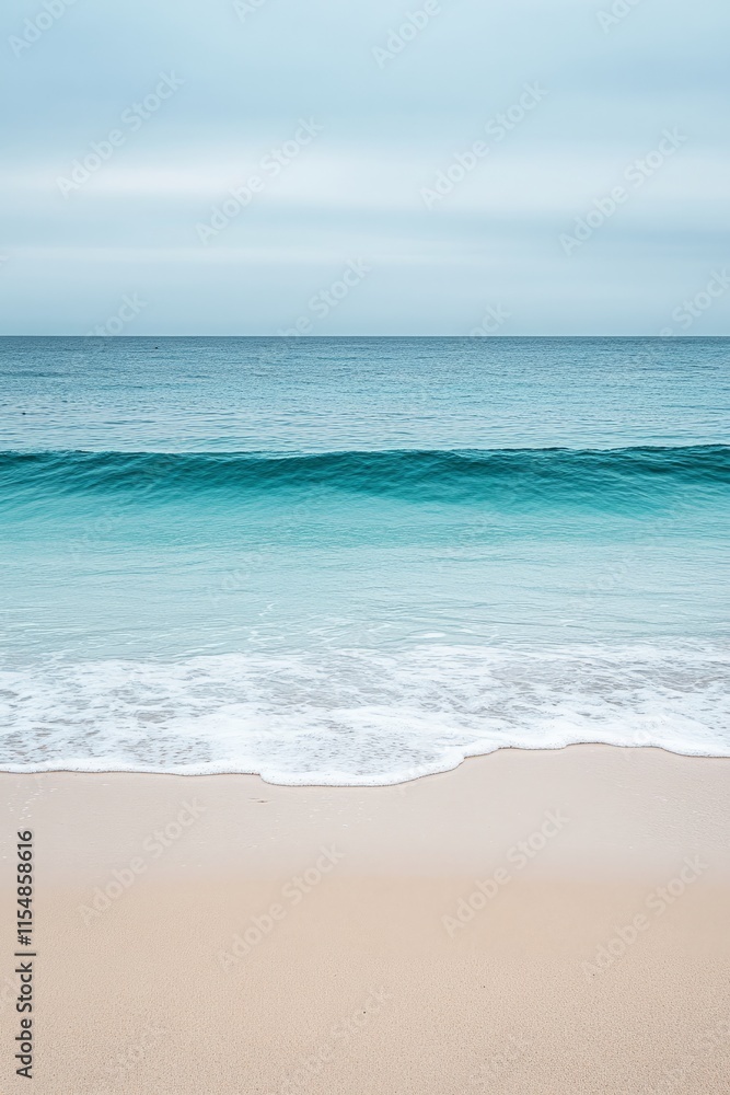 Tranquil ocean waves gently lapping the shore on a serene beach with a cloudy sky, vertical Tranquil ocean waves gently lapping the shore on a serene beach with a cloudy sky, vertical